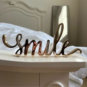 “Smile” Cursive Gold Metal Home Decorative Sign